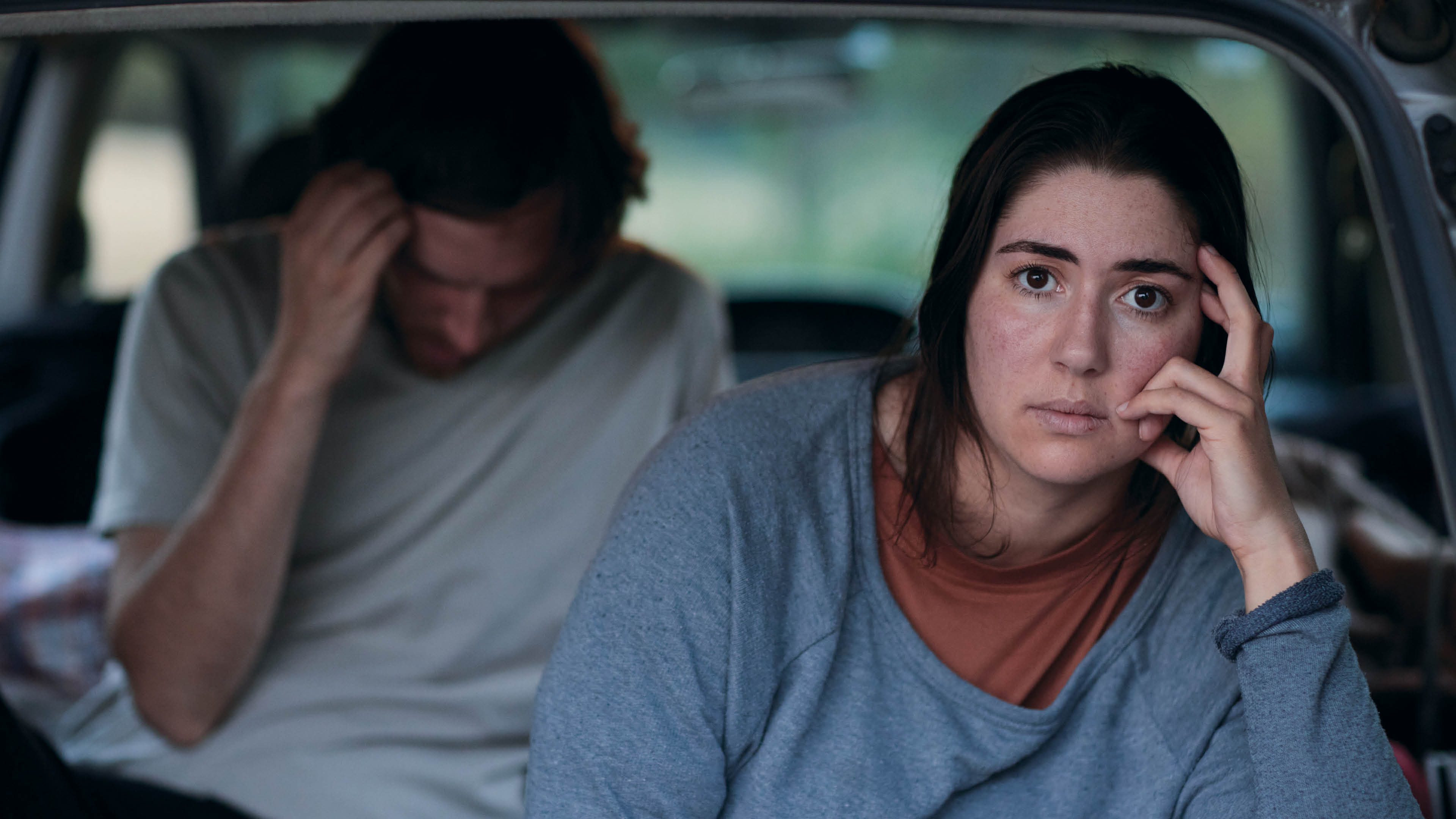 Rachel and Nick looking distressed. They are sitting in a car, believed to be their home for the night.