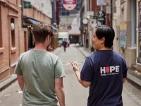 Salvos team member with a youngster