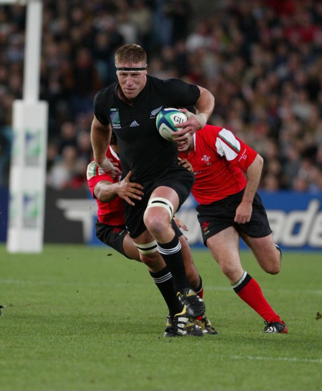 Brad running with the rugby ball